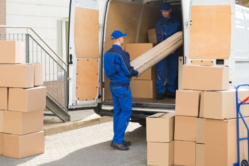 Man And Van Mileend team sorting recyclable materials during a sustainable move