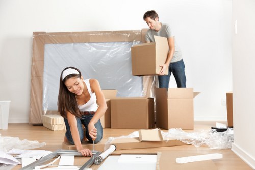 Packing materials and organised moving boxes prepared for a Mile End home move