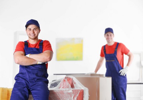 Mover wearing PPE while loading items into a van