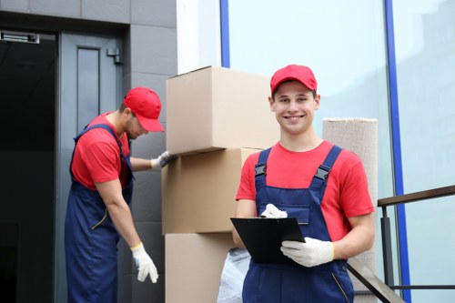 Professional removal team planning a Mileend house move