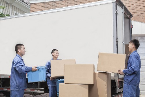 Staff using safe lifting methods during a removal