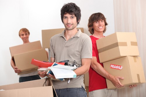 Packing office equipment carefully for a move in Mileend