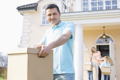 Professional moving team packing household items