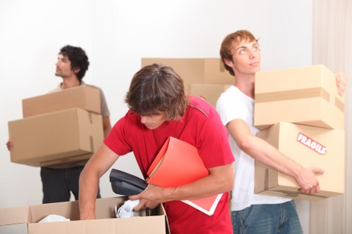 Local movers handling bulky furniture removals in Mileend with careful lifting techniques