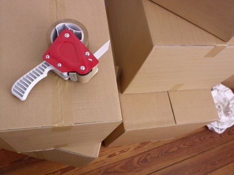 Packed office boxes and furniture ready for relocation