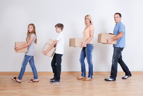 About Us Man And Van Mileend team handling residential moving tasks