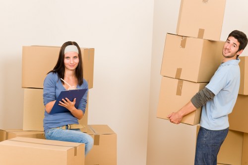 Local office movers transporting equipment in East London